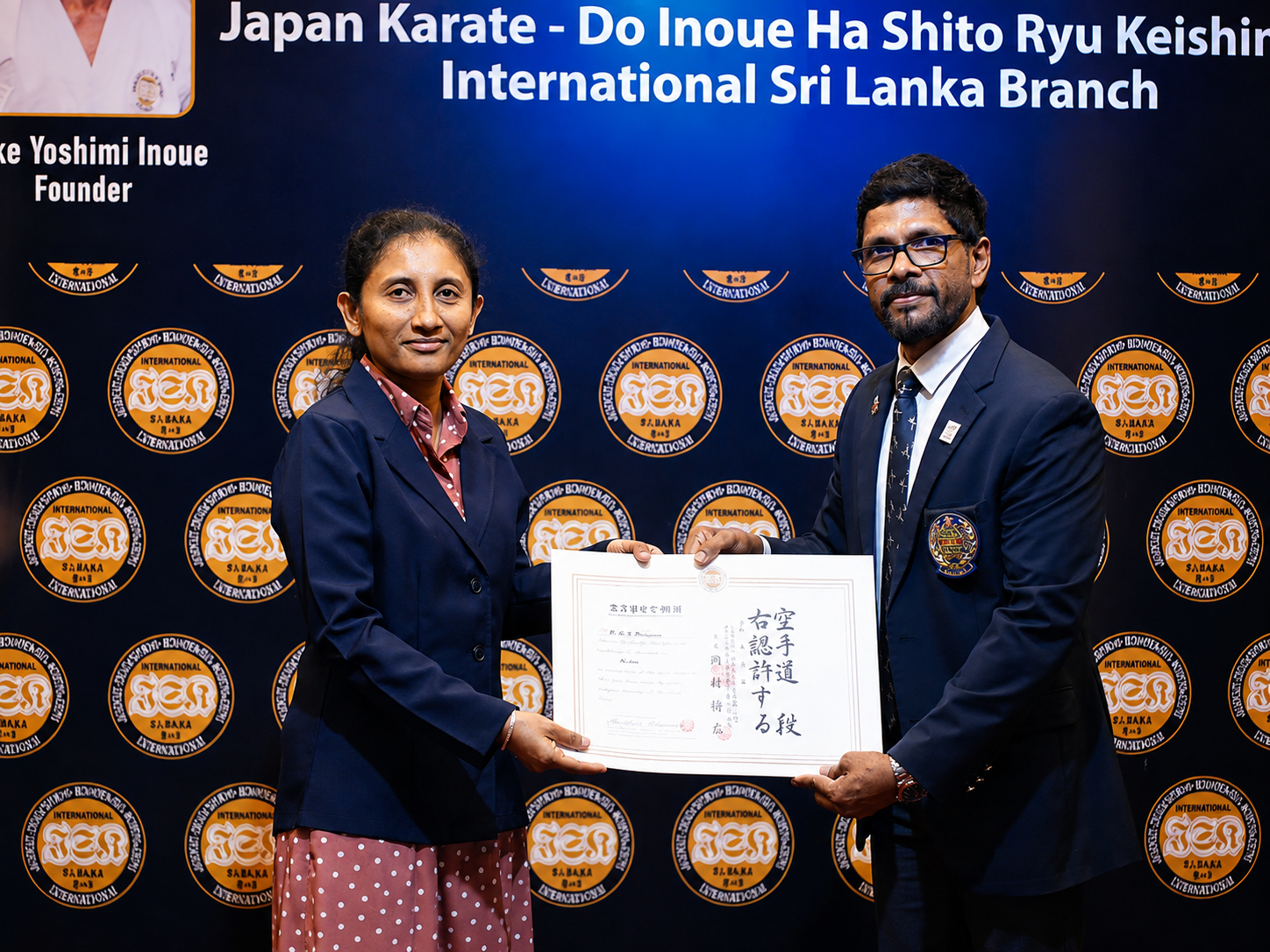 Karate student receiving a black belt diploma from an official